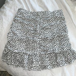 white and green flower patterned mini skirt